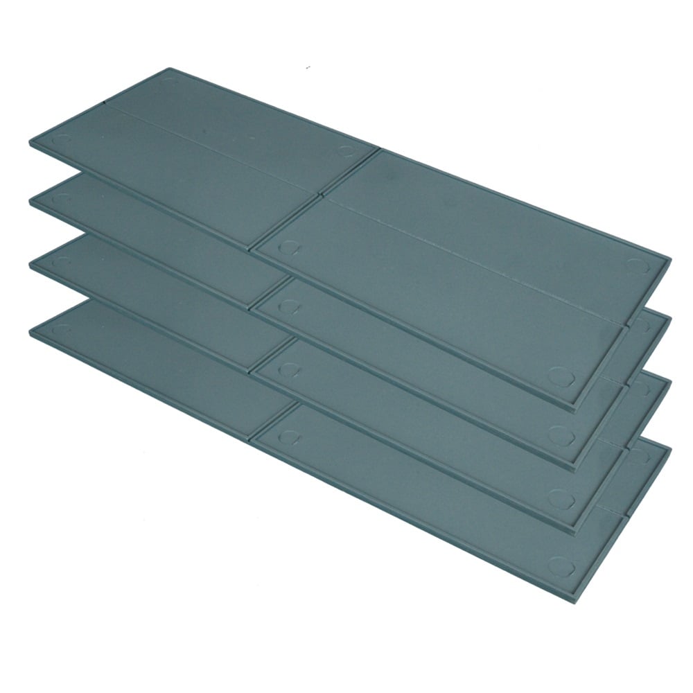 A stack of four dark gray rectangular tray with circular indentations