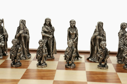 Dal Rossi Evil Ring Metal Chessmen on a wooden board, featuring detailed fantasy figures like wizards, warriors, and hobbit-like pawns