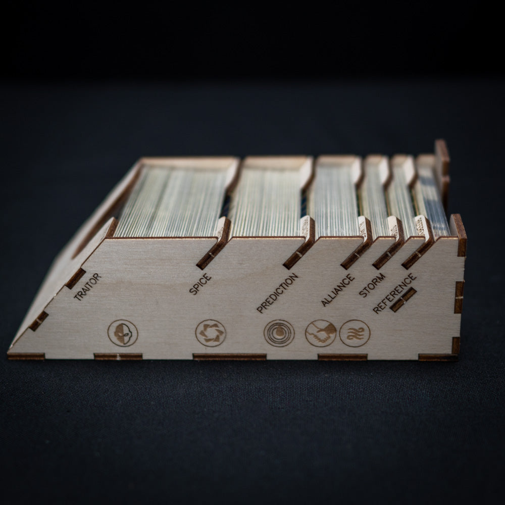 Close-up of Laserox insert trays holding Dune game pieces