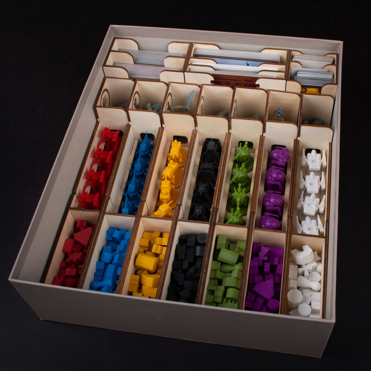 Insert filled with game components and tokens