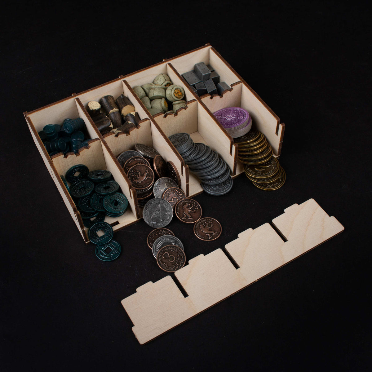Insert with wooden tokens and cards arranged neatly