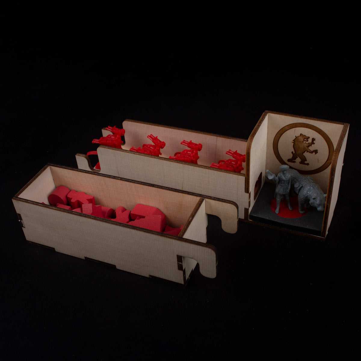 Close-up of insert holding wooden game pieces