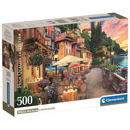 Puzzle box showing a vibrant Italian lakeside town with outdoor cafes, colorful buildings, and a sunset sky.