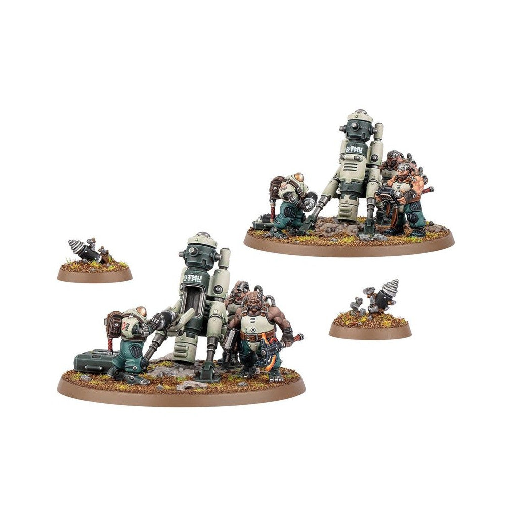 Wargame miniatures: Two groups of armored dwarf-like figures with mechanical drill rigs and weapons, alongside two loose drills