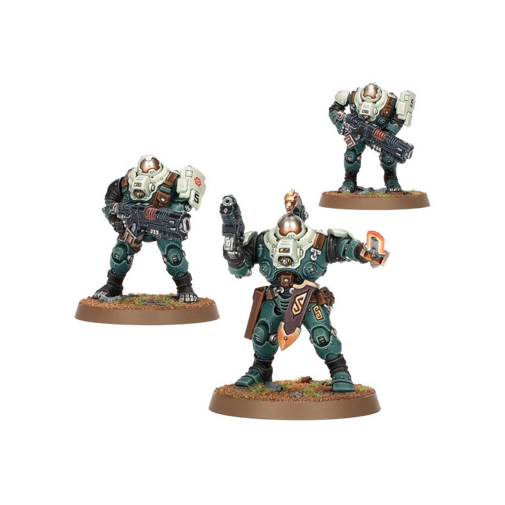 Three Leagues of Votann miniatures in teal & beige armor: two with rifles, one with a pistol & glowing device