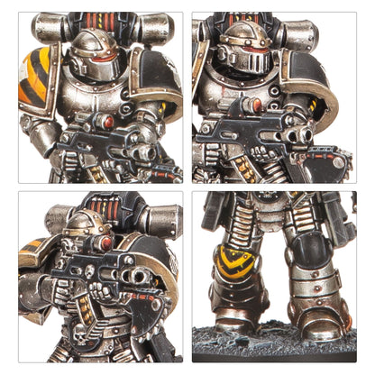 Heavily armored miniature warrior in black and silver power armor with yellow hazard stripes, holding a rifle, on a rocky base
