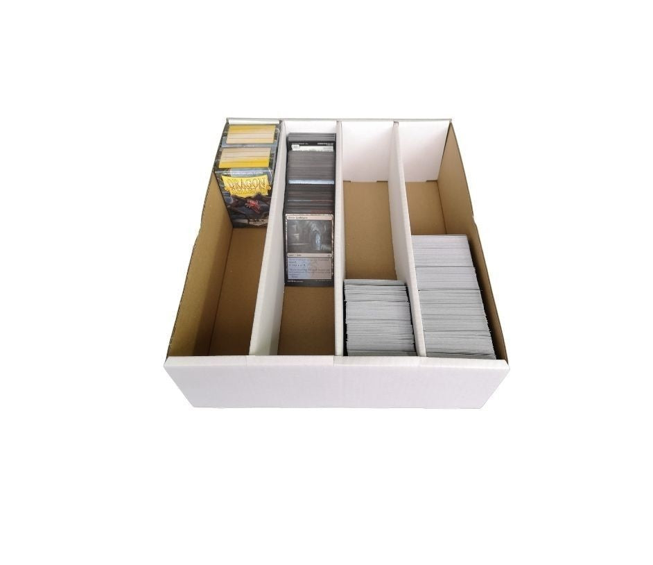White cardboard storage box with internal dividers filled with stacks of trading cards.
