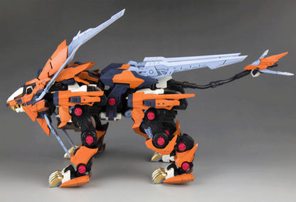 Orange, black, and blue Zoid Liger model stands, featuring prominent head and back blades, and a segmented tail weapon