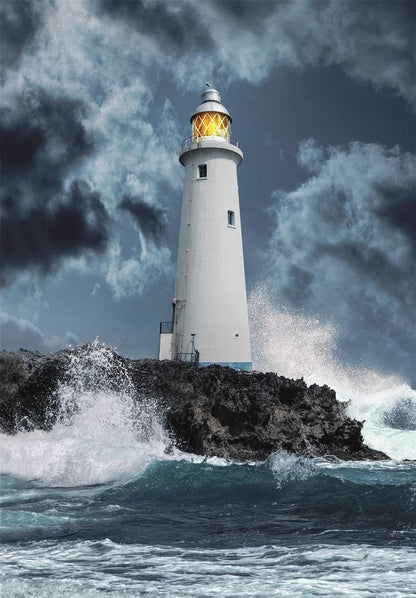 White lighthouse, lamp glowing, on rocky outcrop. Dark storm clouds and powerful waves crash against the base