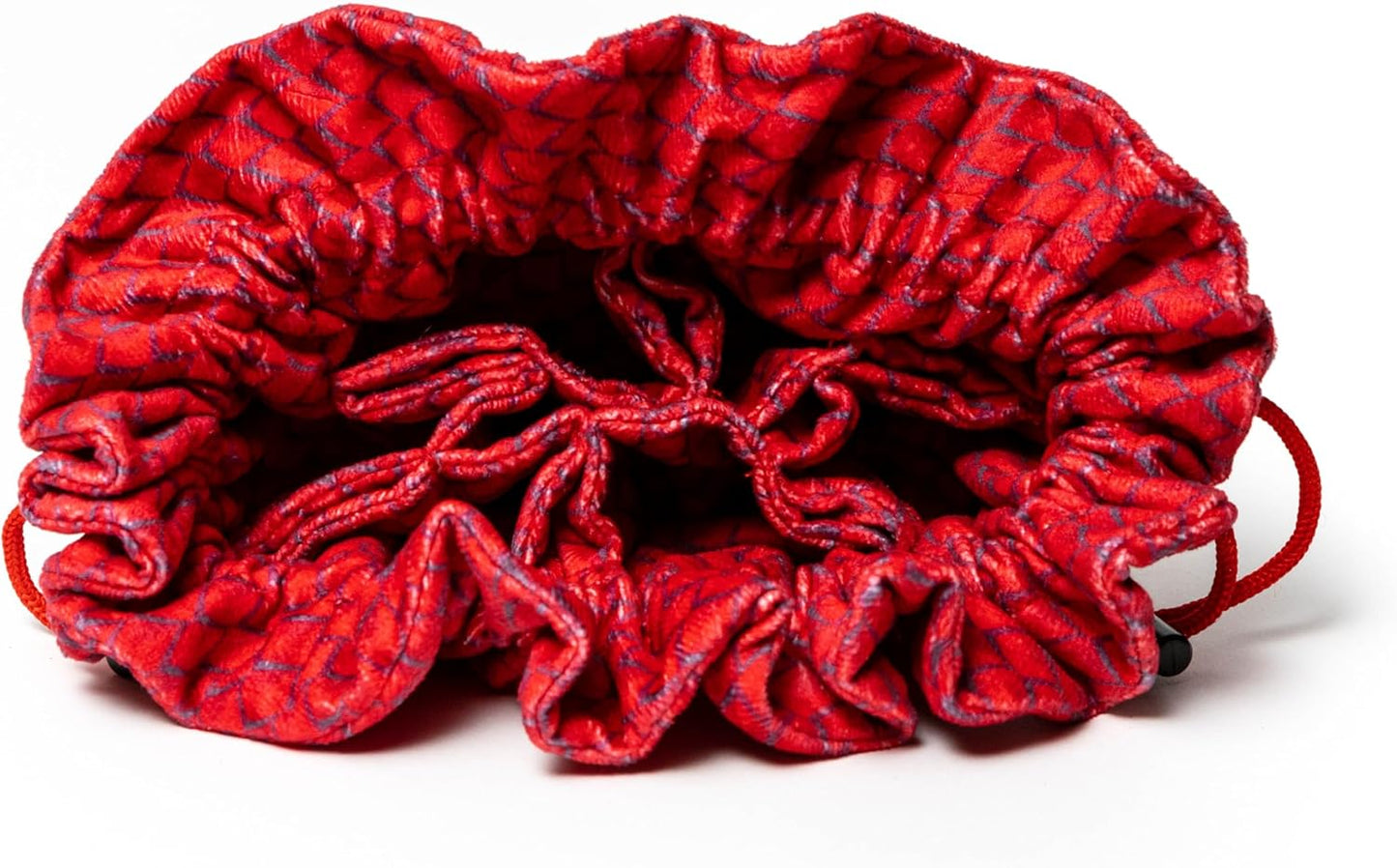 Red drawstring pouch, open and gathered at the top, showing a dark geometric pattern