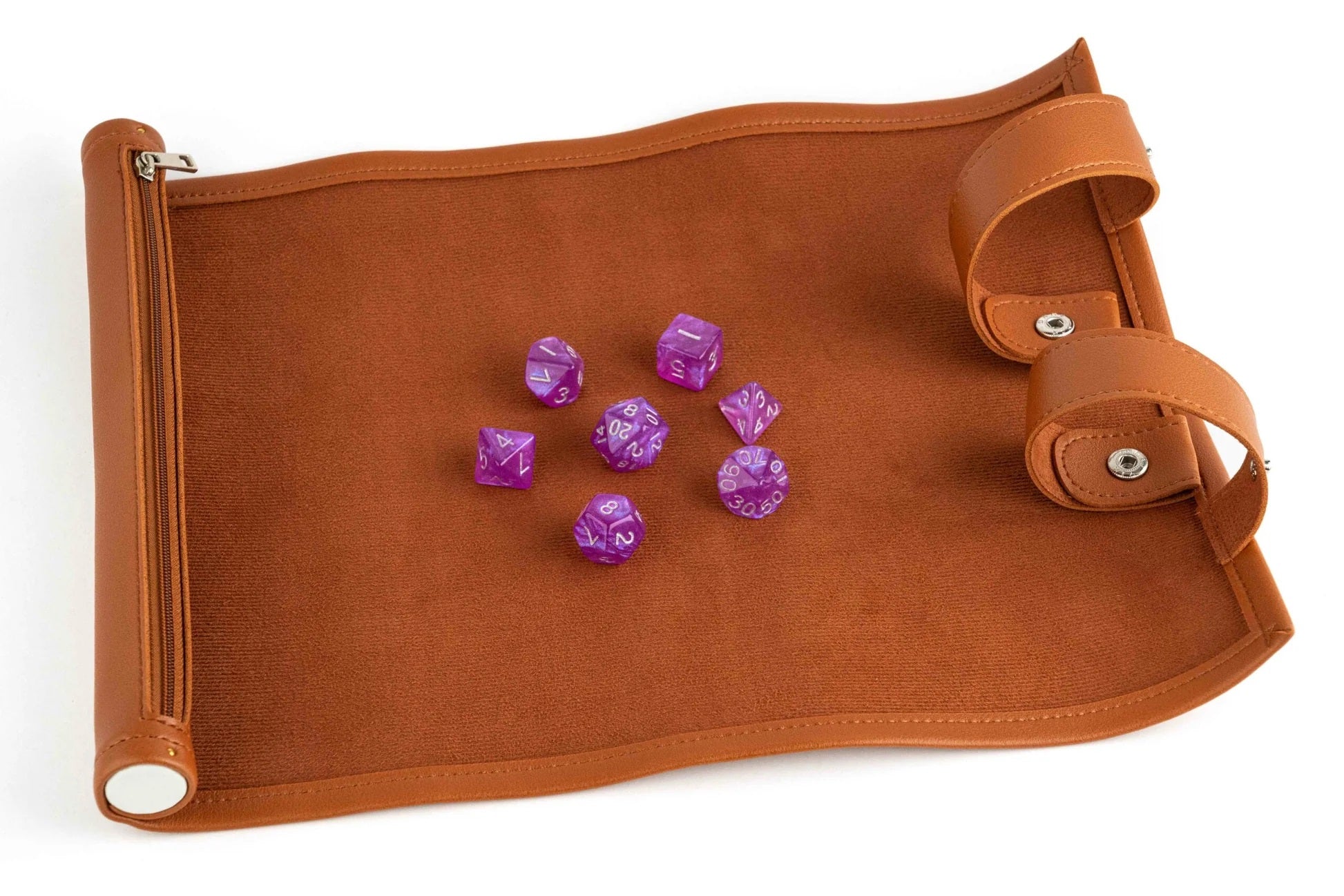 Seven purple polyhedral dice scattered on an unrolled brown dice rolling mat