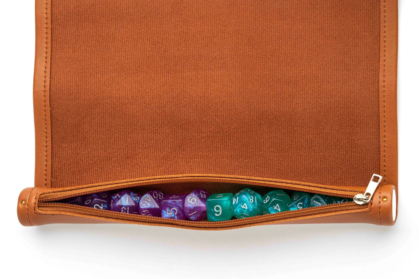A textured brown roll-up bag with a partially open zipper revealing purple and green polyhedral dice