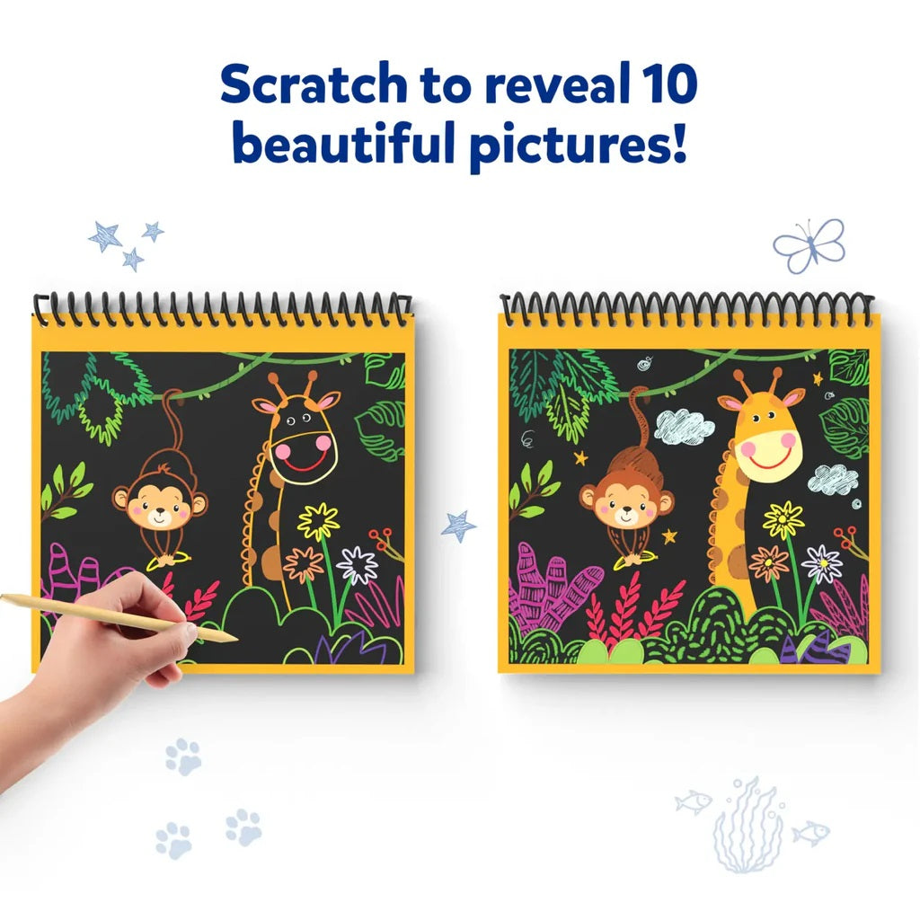 Hand scratching a black scratch art pad to reveal a colorful jungle picture of a monkey and giraffe