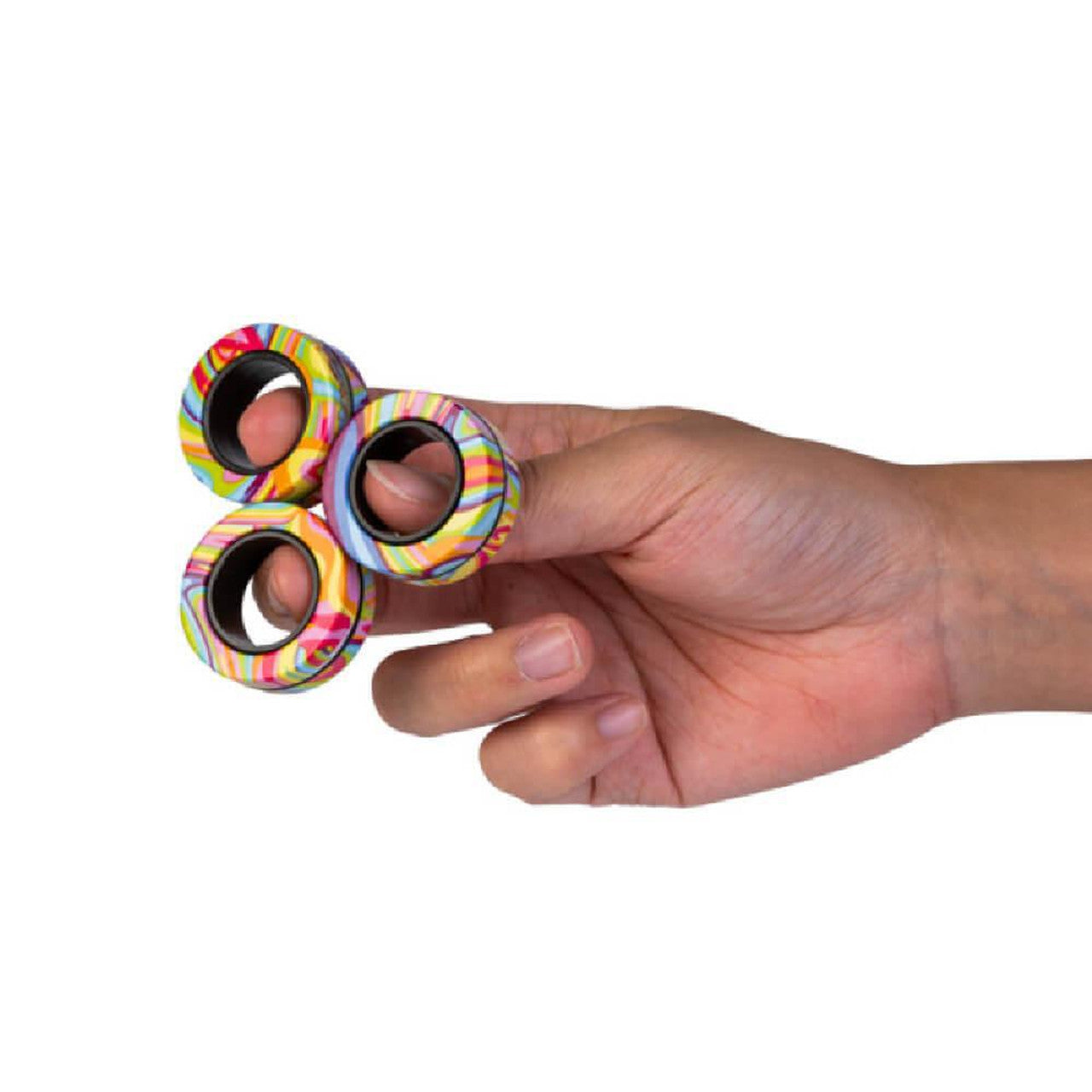 A hand holds three colorful, rainbow-striped fidget rings