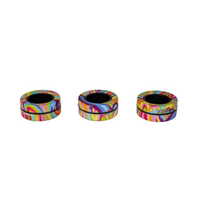 Three donut-shaped objects with vibrant, multi-color swirl patterns and black centers