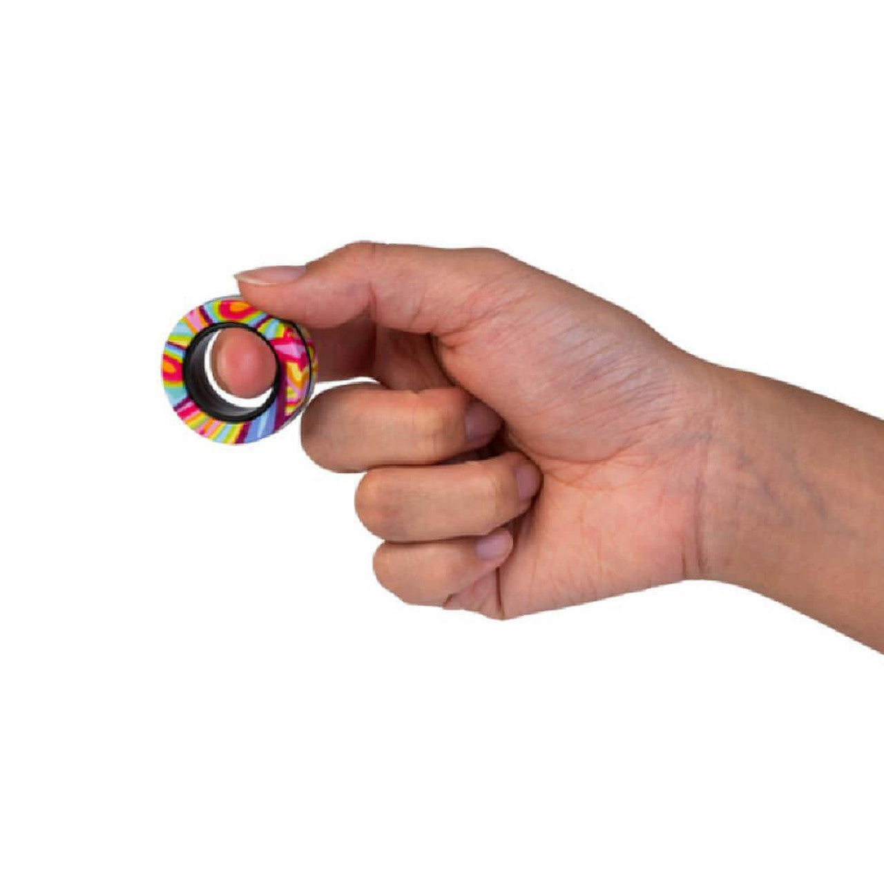 A hand holds a colorful, striped ring between its thumb and index finger