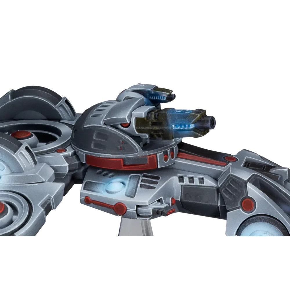 A gray sci-fi miniature hovercraft with red accents, featuring a central turret with a bright blue glowing energy weapon