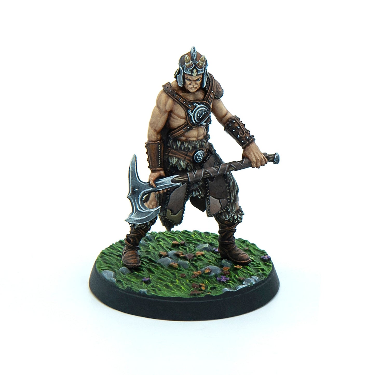 Hand-painted miniature barbarian figure with horned helmet and fur armor, holding a battleaxe, on a grassy base