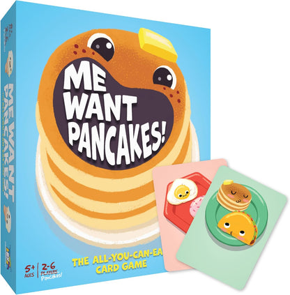 Me Want Pancakes! card game box. Cover shows a cartoon pancake stack with a wide mouth shouting the title. Two game cards with cute food are visible