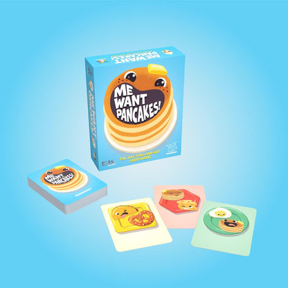 Me Want Pancakes! card game box with a pancake mascot, a stack of cards and three colorful food-themed game cards