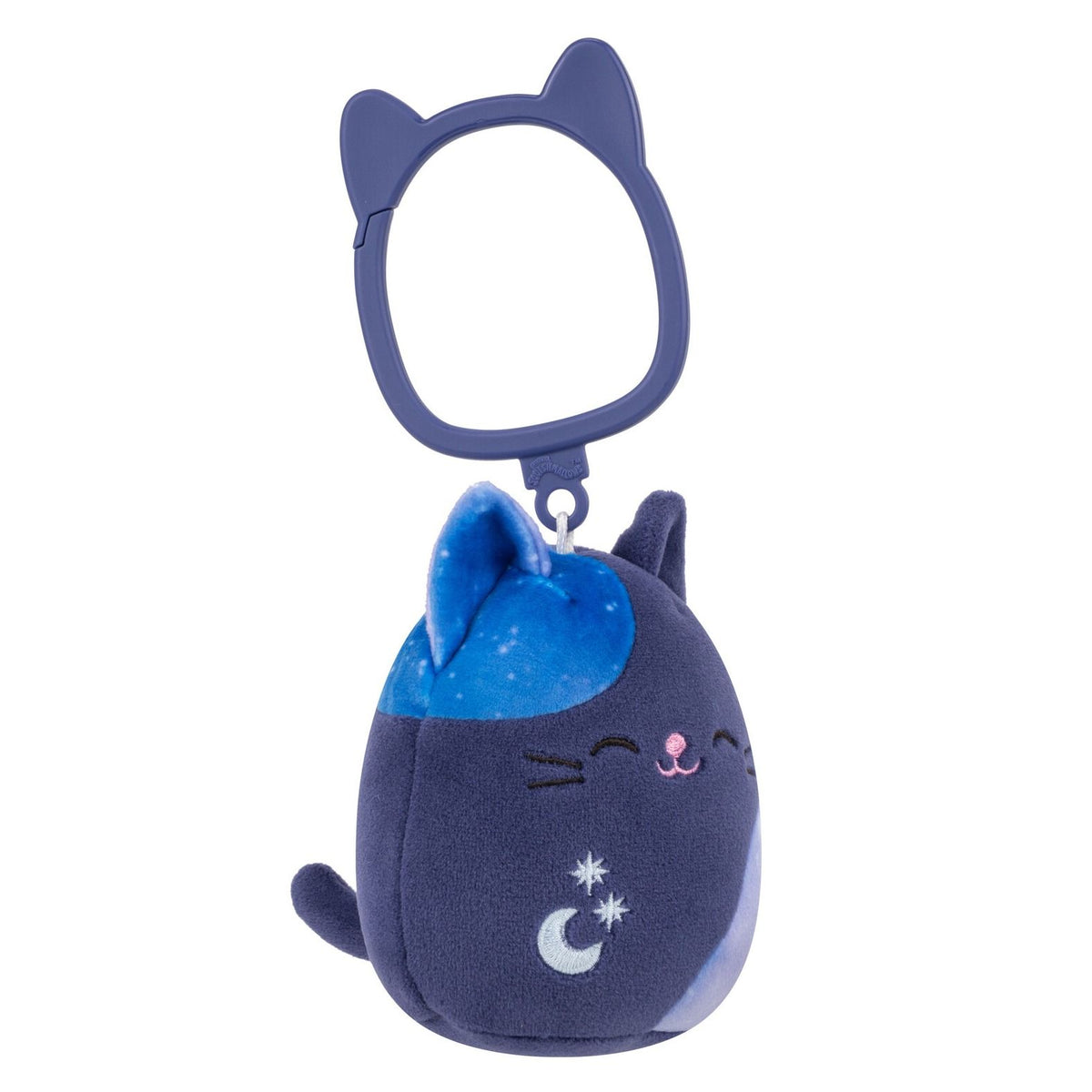 Side view of Dark blue plush cat keychain with celestial print spots, embroidered stars and moon, and a plastic cat-ear shaped clip