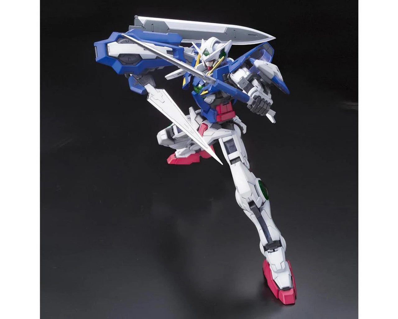 A blue, white, and red Gundam Exia model in a dynamic pose, wielding two long swords