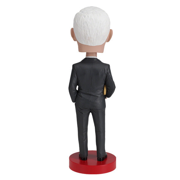 Royal Bobbles Mike Pence bobblehead figurine in a dark suit on a red base back view