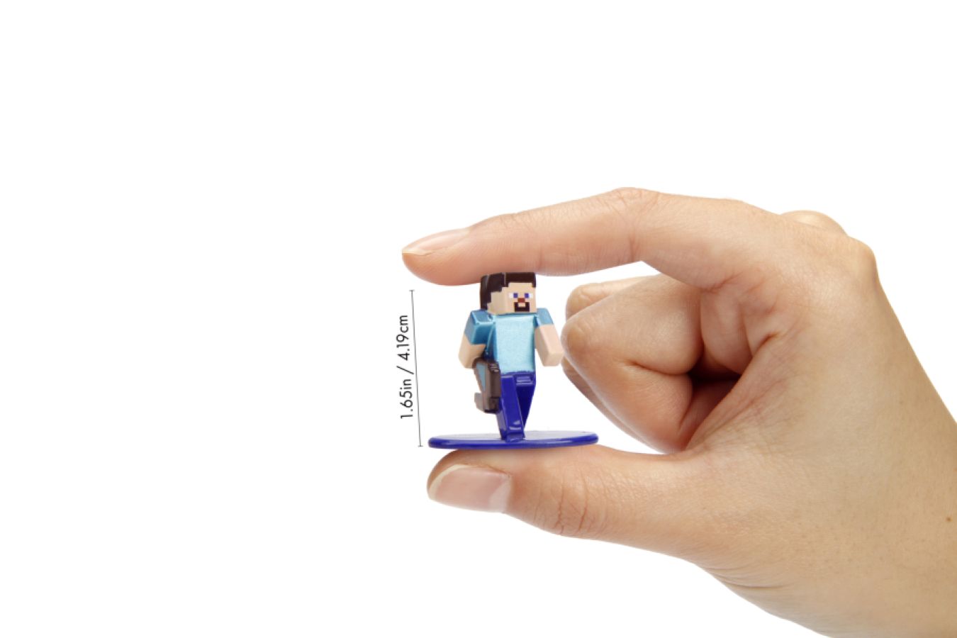 Hand holding a miniature Minecraft Steve figure on a blue stand, with blocky features and blue shirt