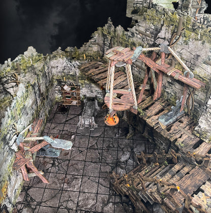 Fantasy Dungeon - Mining Lift: Detailed miniature fantasy dungeon terrain with a suspended glowing cauldron and stone coffin