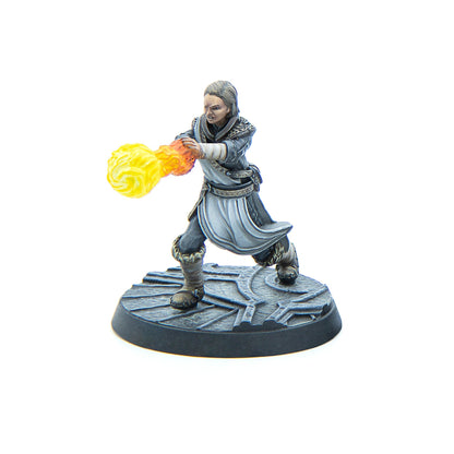 Miniature of a male figure in dark robes casting a glowing yellow and orange fireball from his hands on a carved base