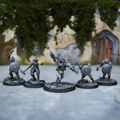 Five painted fantasy miniatures: an armored bear-creature charges, flanked by four warriors with shields & axes.