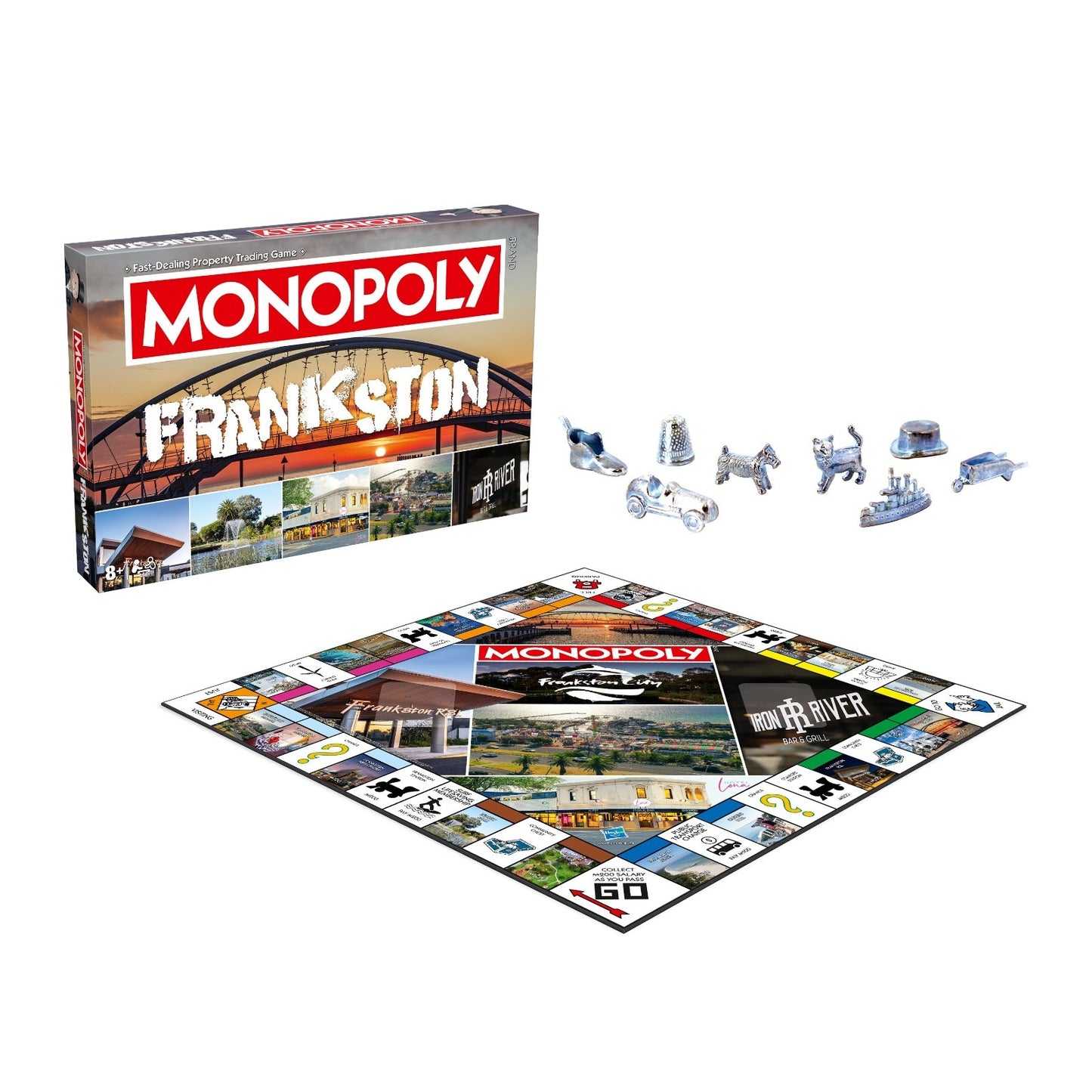 A Monopoly Frankston edition box and game board showcasing local landmarks, along with eight silver game tokens including a boot, dog, car, and battleship