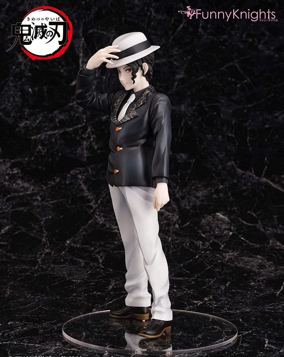 Side view of anime figure of a character with red eyes, in a black blazer, white pants, and fedora, adjusting his hat om marble background