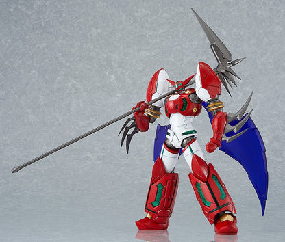 A red, white, and blue robot action figure with blue wings holds a long spiked polearm