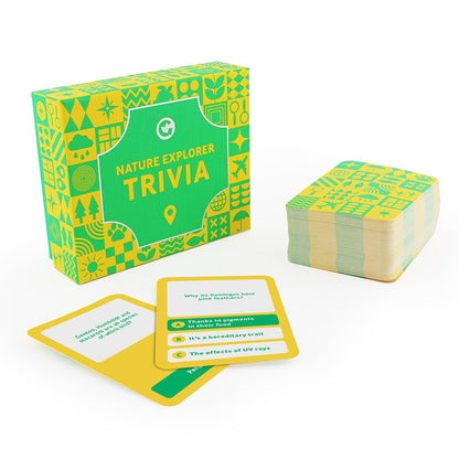 A green and yellow "Nature Explorer Trivia" game box and cards, one showing a nature question with multiple-choice answers