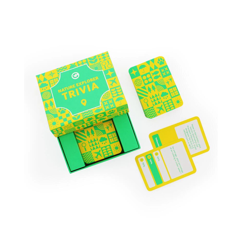 Open green and yellow &#39;Nature Explorer Trivia&#39; game box with cards featuring nature icons and trivia questions