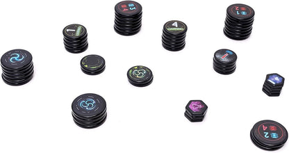 Stacks of black circular and hexagonal game tokens with colorful symbols and numbers, arranged on white