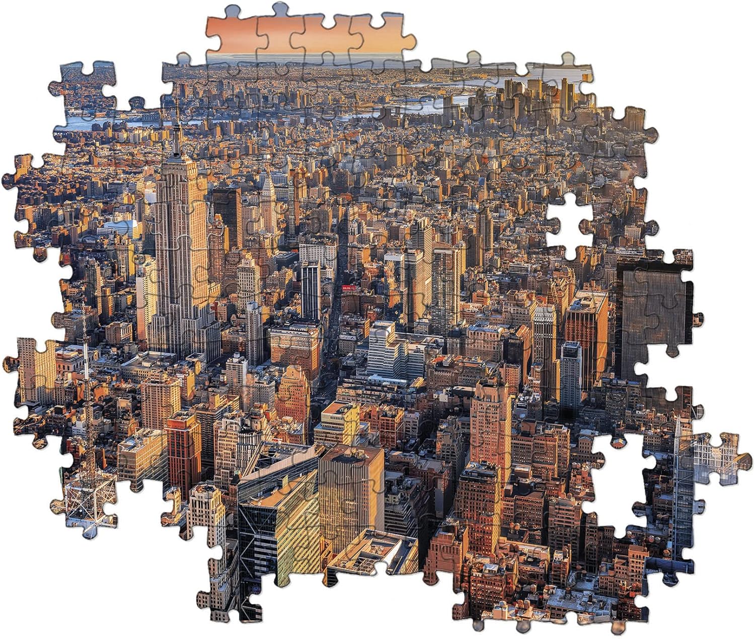 Jigsaw puzzle of an aerial New York City skyline at sunset, showing the Empire State Building and missing pieces.