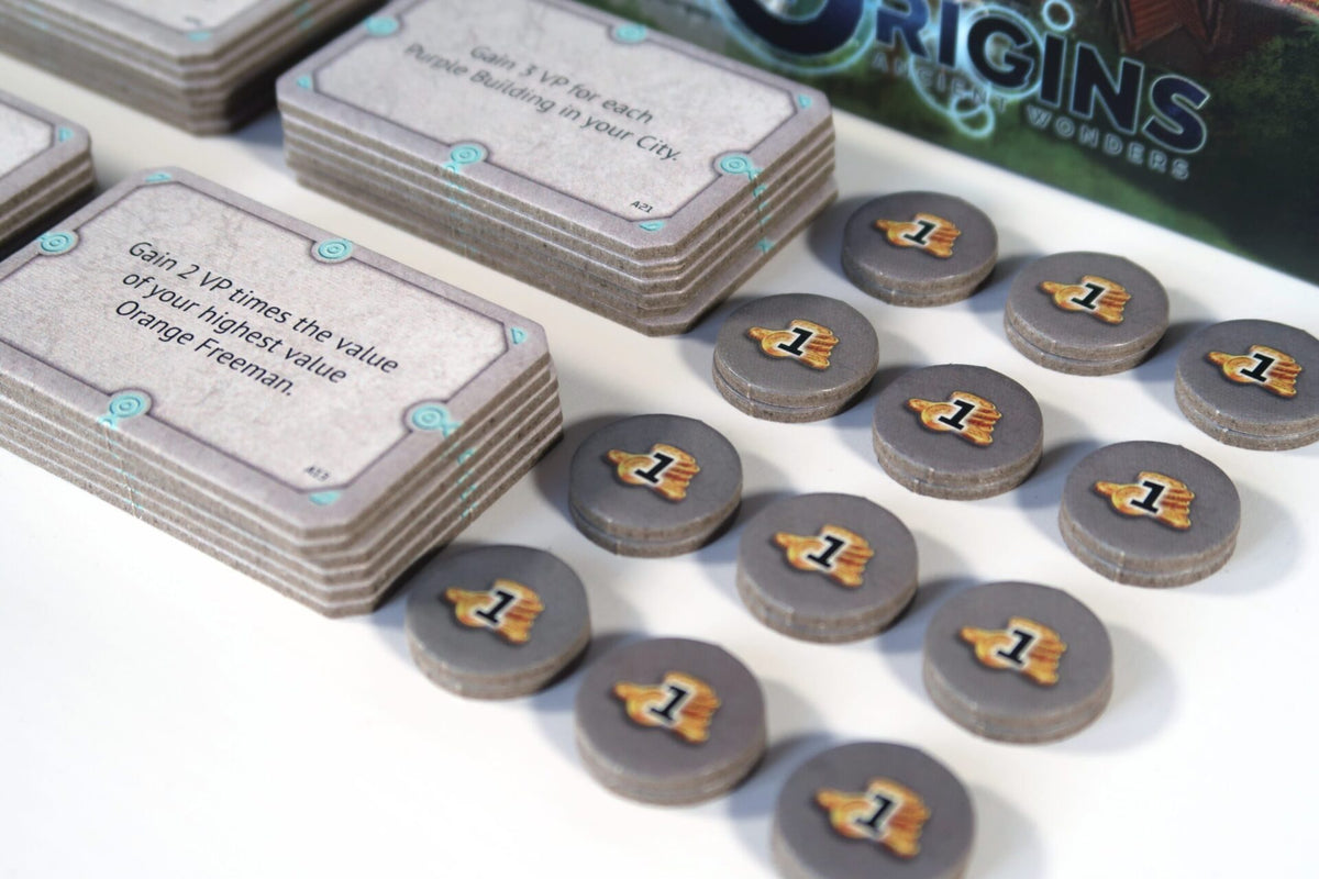 Origins: Ancient Wonders game cards and playing tokens close-up