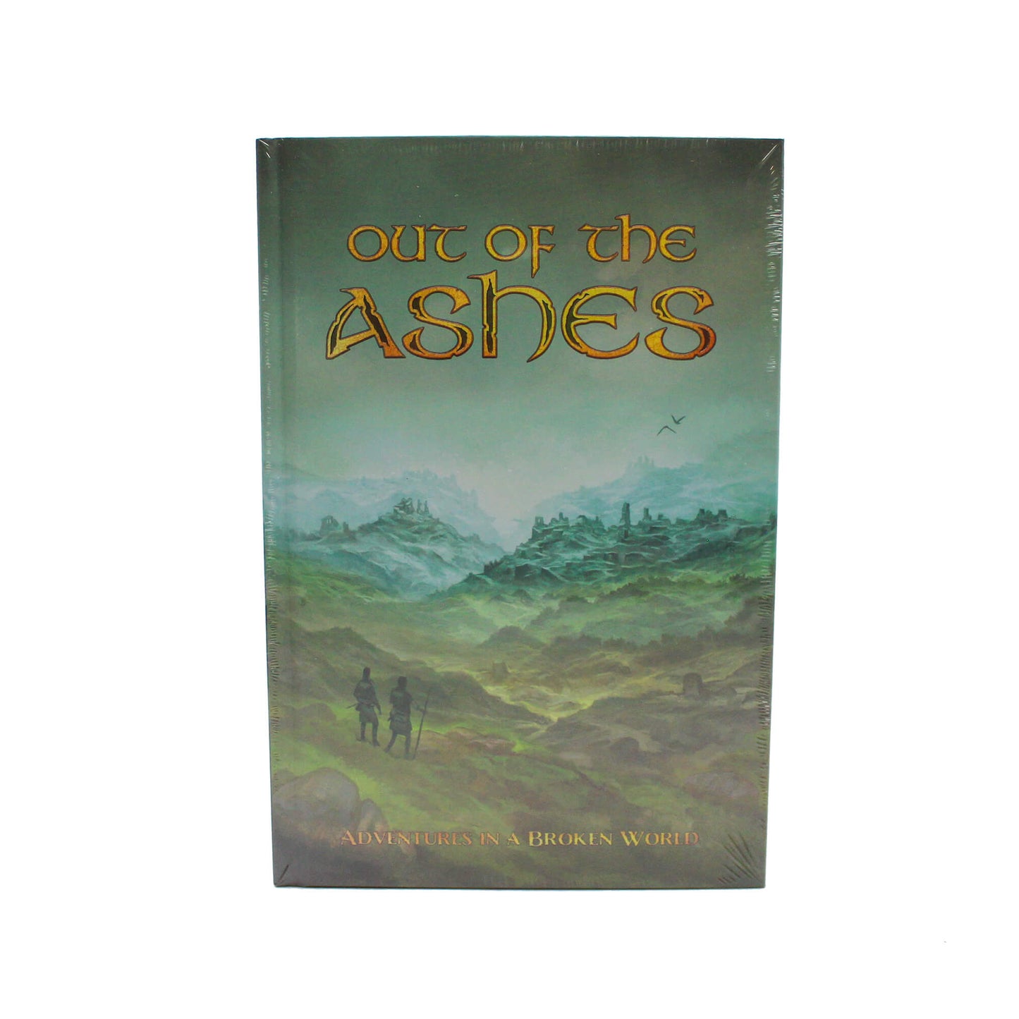 Shrink-wrapped Out Of The Ashes Adventures in a Broken World book with a cover illustration of two figures in a desolate landscape of ruins