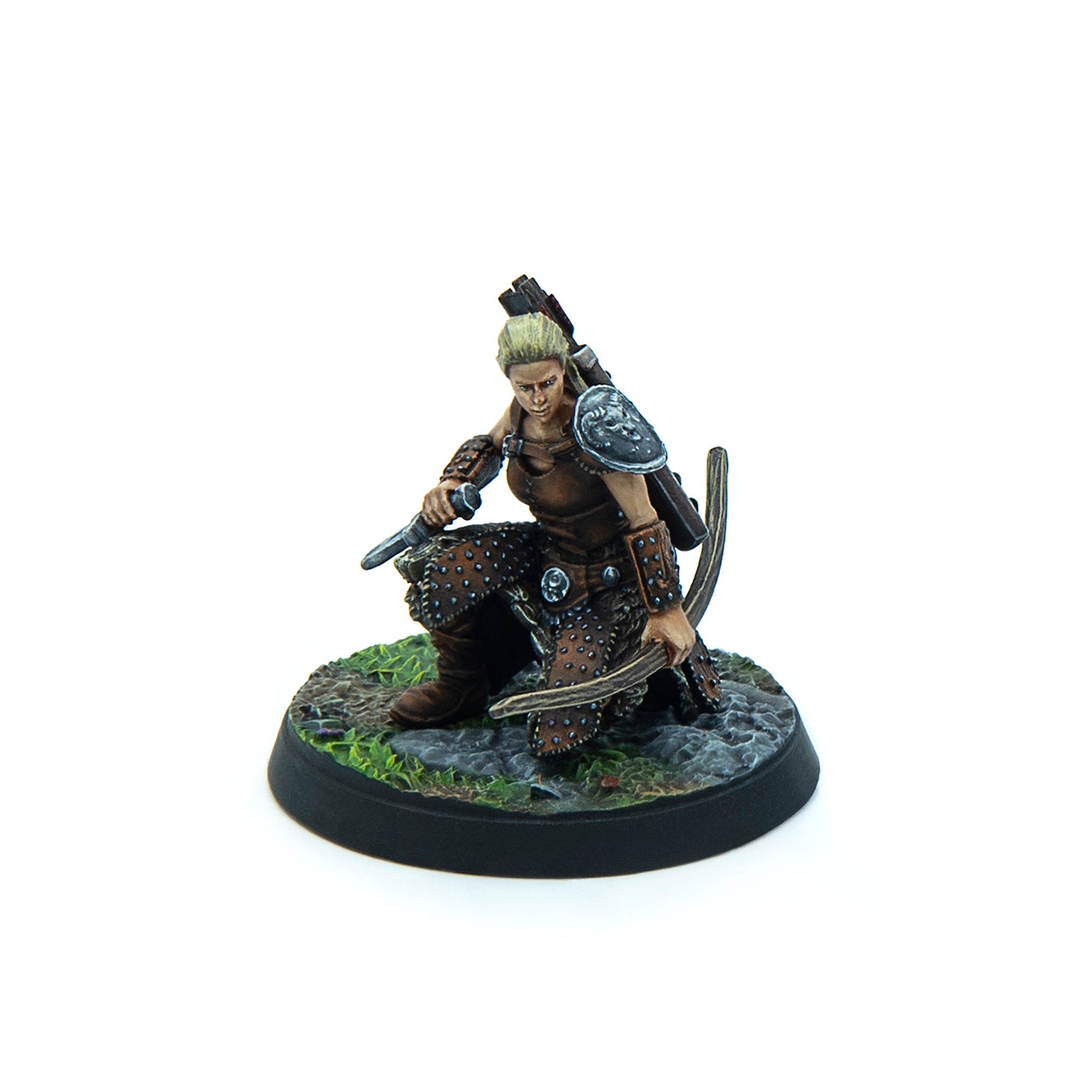 Miniature of a blonde female warrior in studded leather armor, crouching, holding a knife and bow
