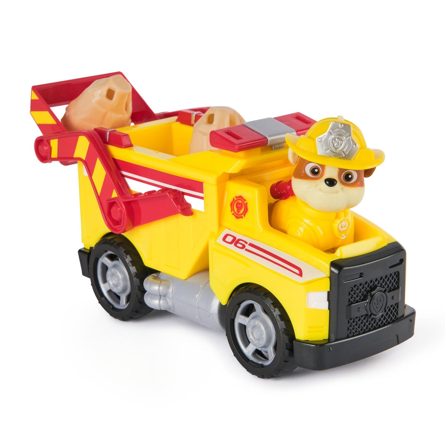Paw Patrol Rubble's yellow construction toy truck with red accents, black wheels, and tan rocks in the scoop