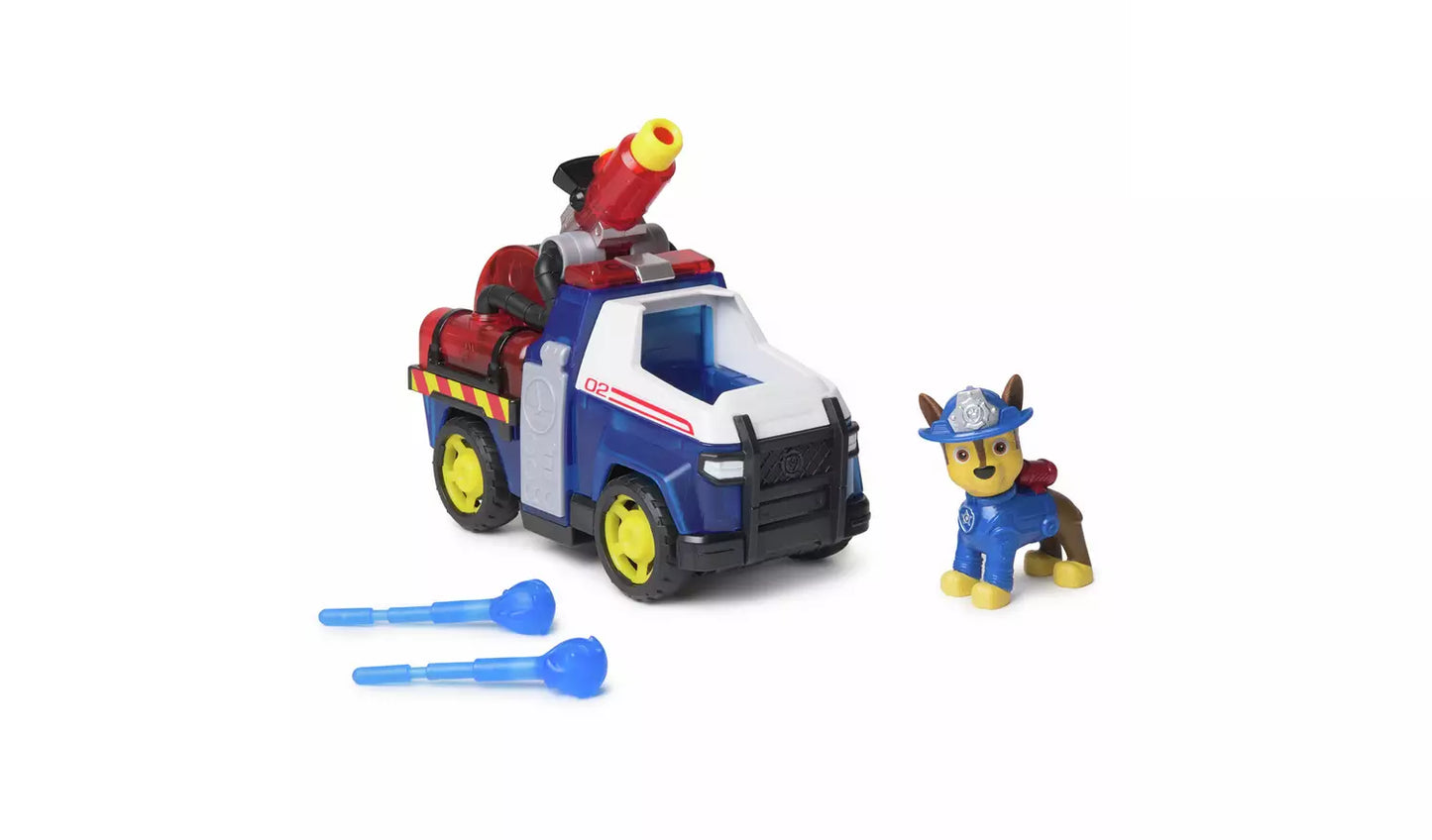 Blue and white toy fire truck with red water cannon, Paw Patrol Chase figure, and two blue projectiles
