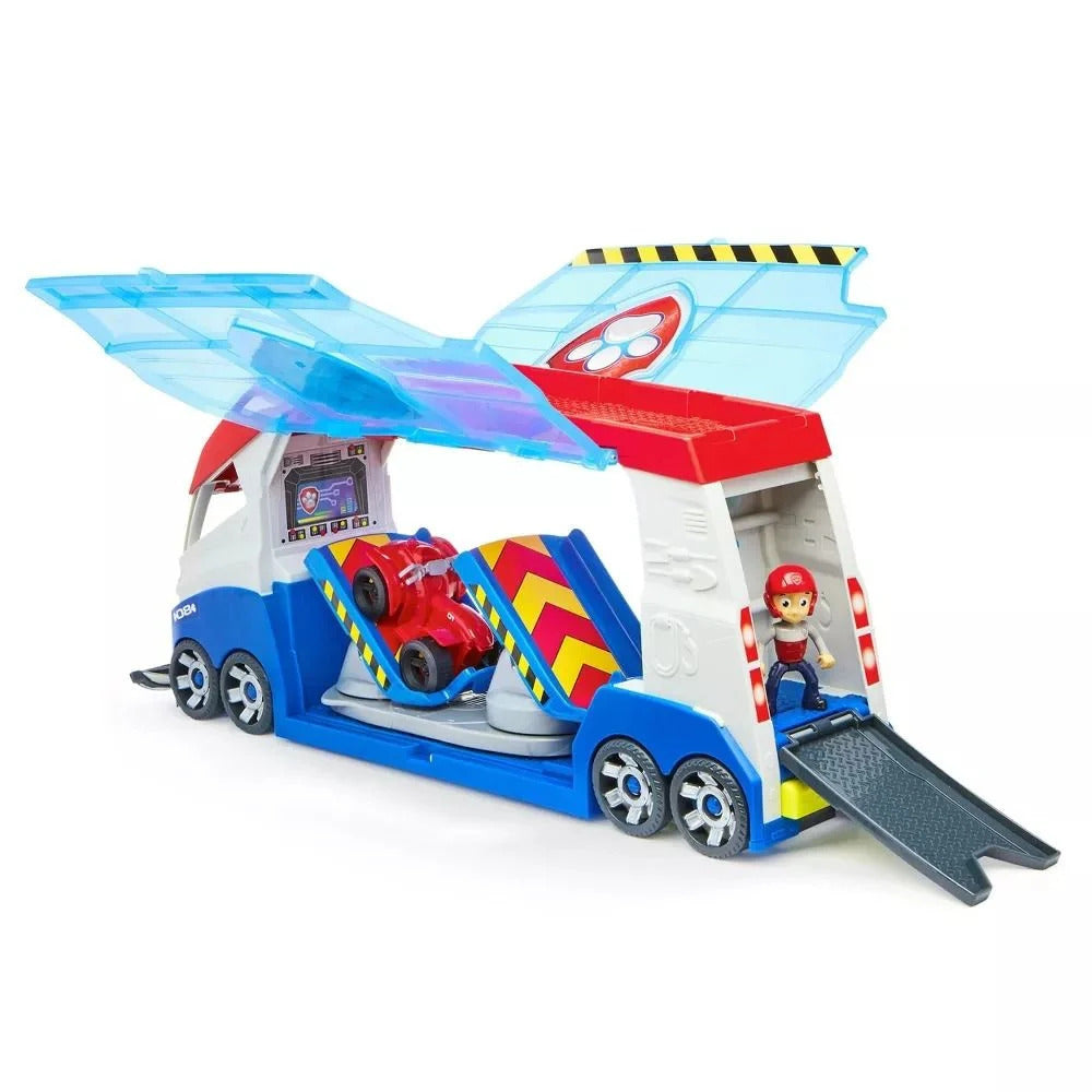 Paw Patrol Ryder's command center toy truck playset, white, blue & red, with open clear wings, red ATV inside, and Ryder figure by a lowered rear ramp