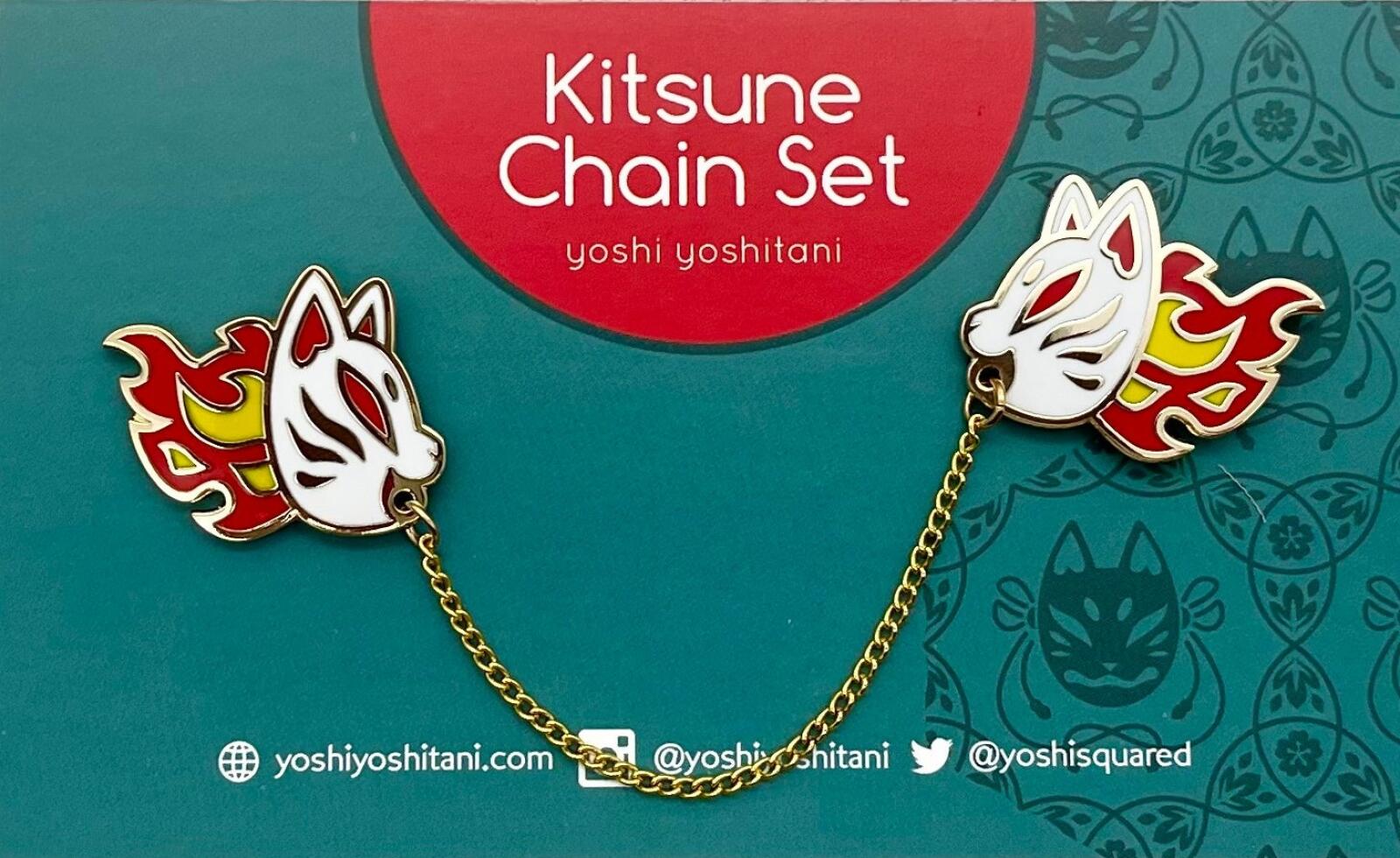 Two white Kitsune masks with red flames, connected by a gold chain, on a teal product card.