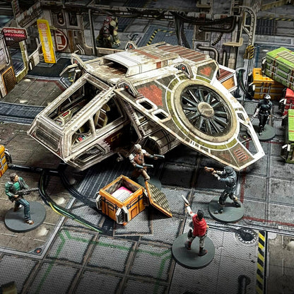 A large spaceship is landed on a futuristic tabletop wargame board, surrounded by armed miniature figures and cargo crates