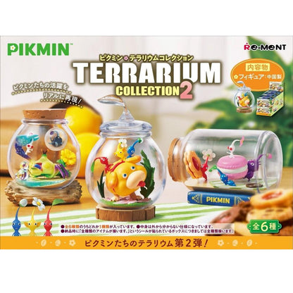 Three clear terrariums from the Pikmin Terrarium Collection 2, showcasing colorful Pikmin characters and creatures