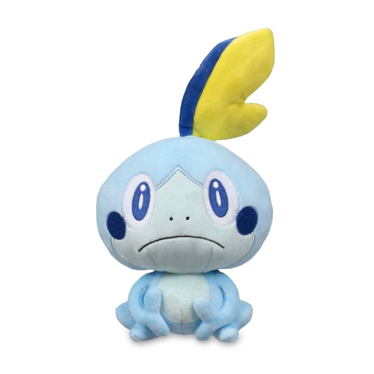 Light blue Sobble Pokemon plush with a sad face and a yellow and blue fin on its head, sitting