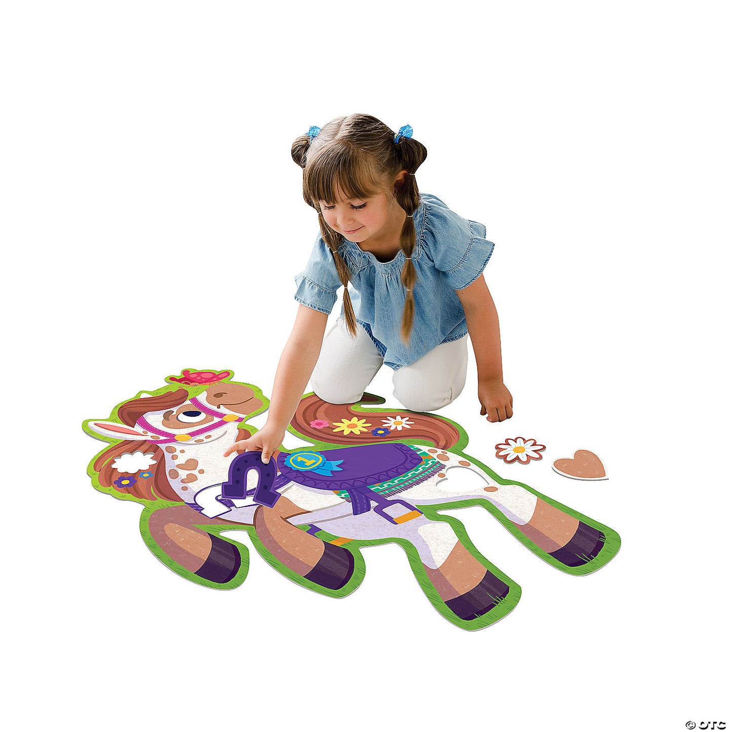 Girl child playing with the Pony floor puzzle on the floor