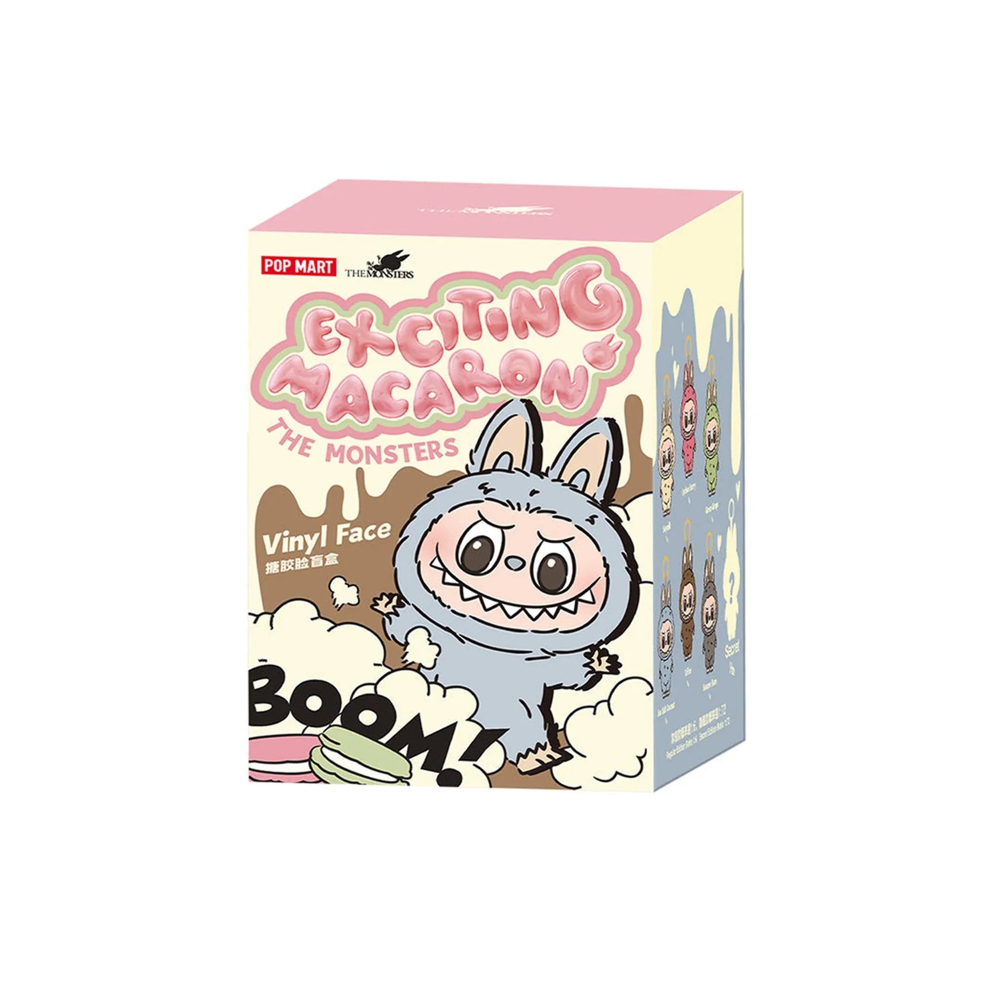 POP MART "Exciting Macaron" blind box featuring a grey, fanged, rabbit-eared monster, "BOOM!", and a macaron